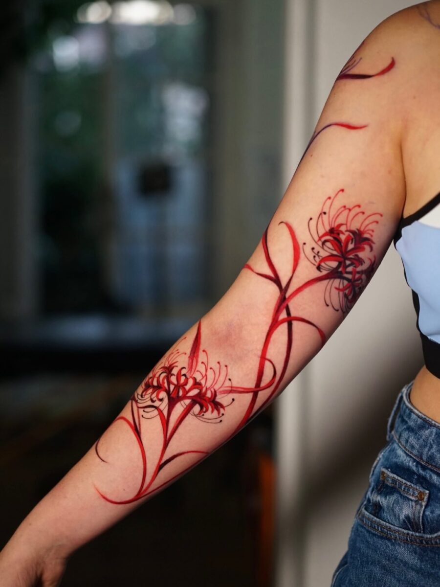 Delicate red ink leaf tattoo design on shoulder Tattoo Design