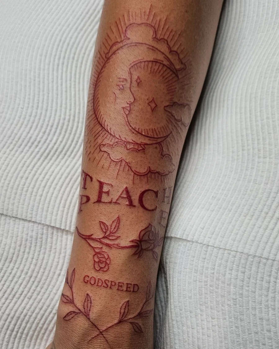 Elegant red ink fan tattoo with floral accents Tattoo Design