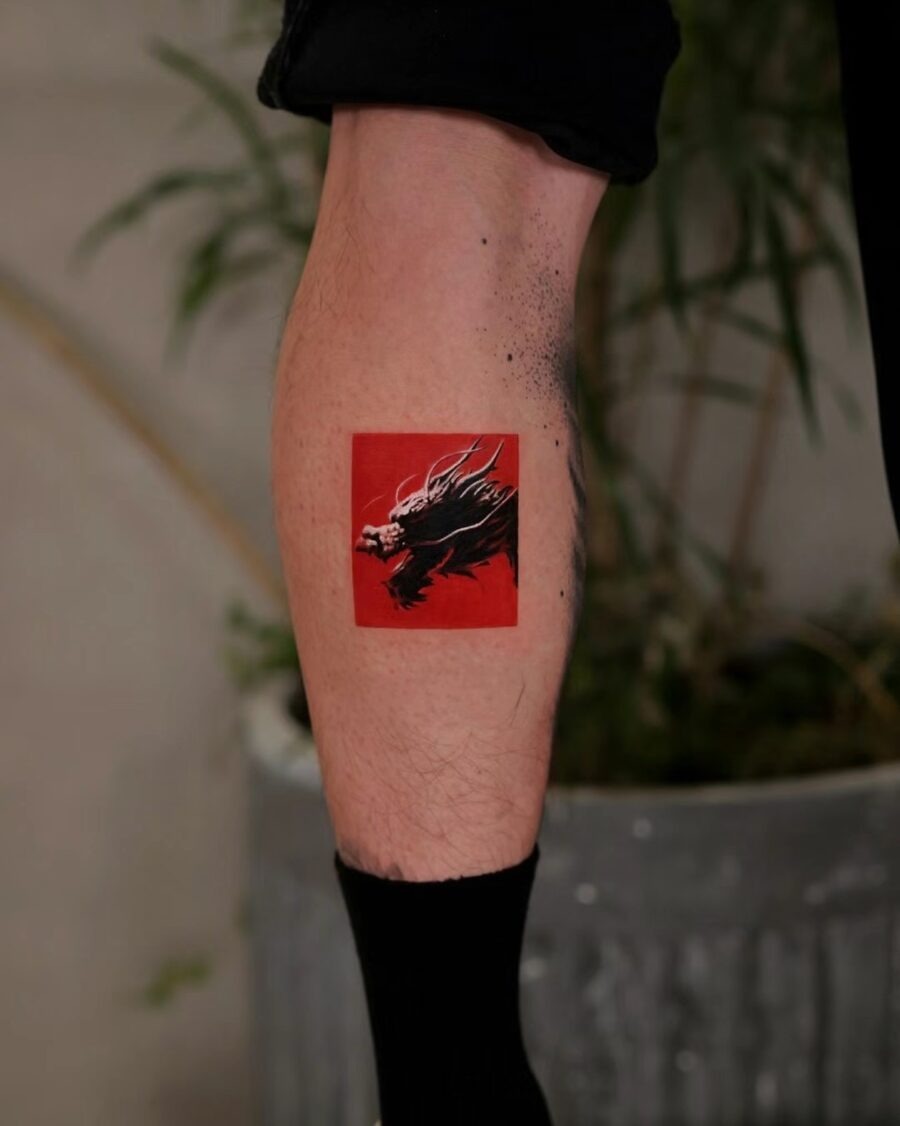 Elegant red ink floral tattoo on arm Tattoo Design