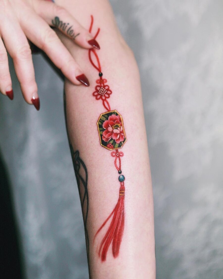 Elegant red ink roses on female thigh Tattoo Design