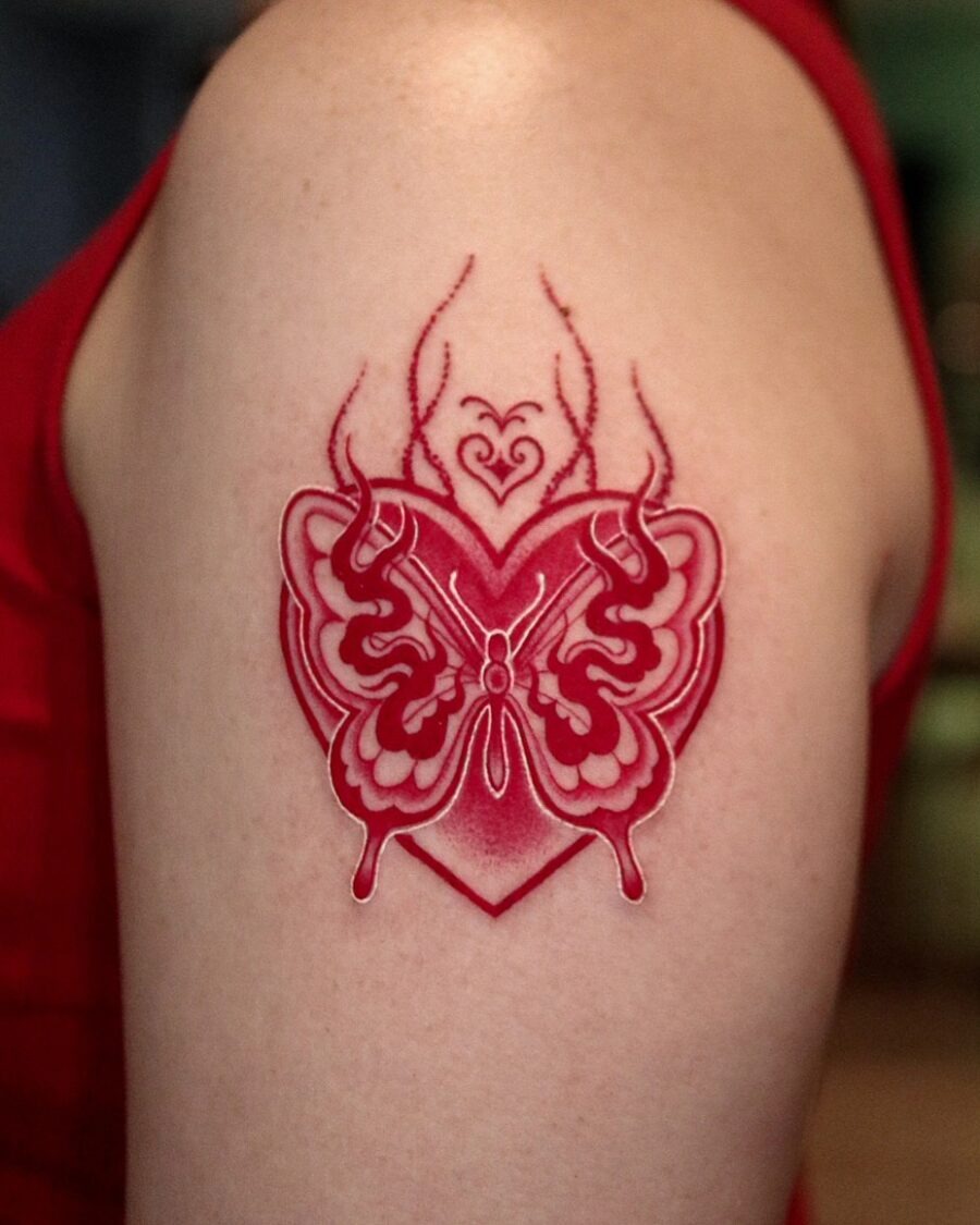 Elegant red ink tattoo with floral details Tattoo Design