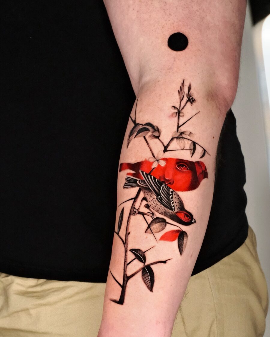 Elegant red ink tattoo with swirling patterns Tattoo Design