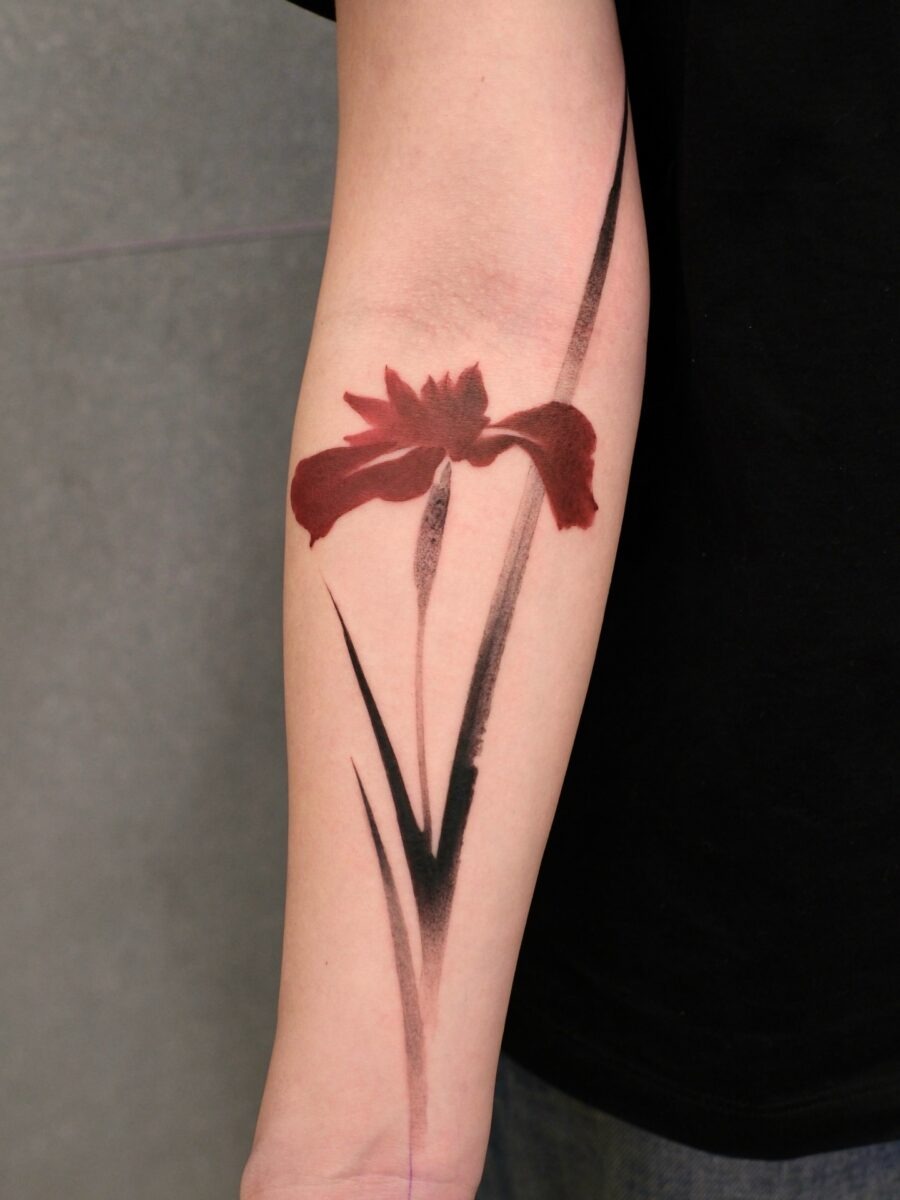 Elegant red ink vase tattoo with floral details Tattoo Design