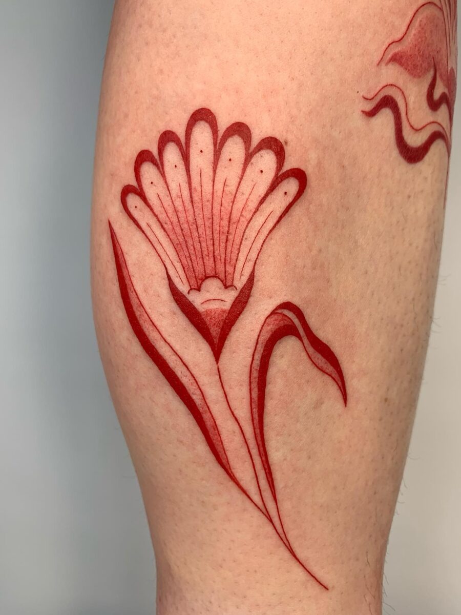 Intricate red ink dragon tattoo detail Tattoo Design
