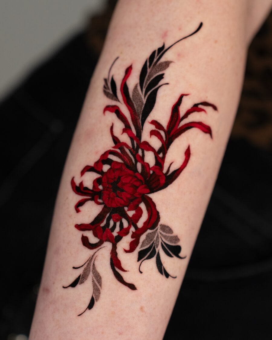 Intricate red ink eye tattoo design in hand Tattoo Design