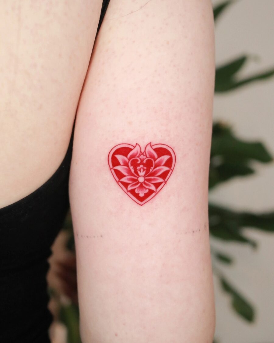 Intricate red ink floral arm tattoo design Tattoo Design