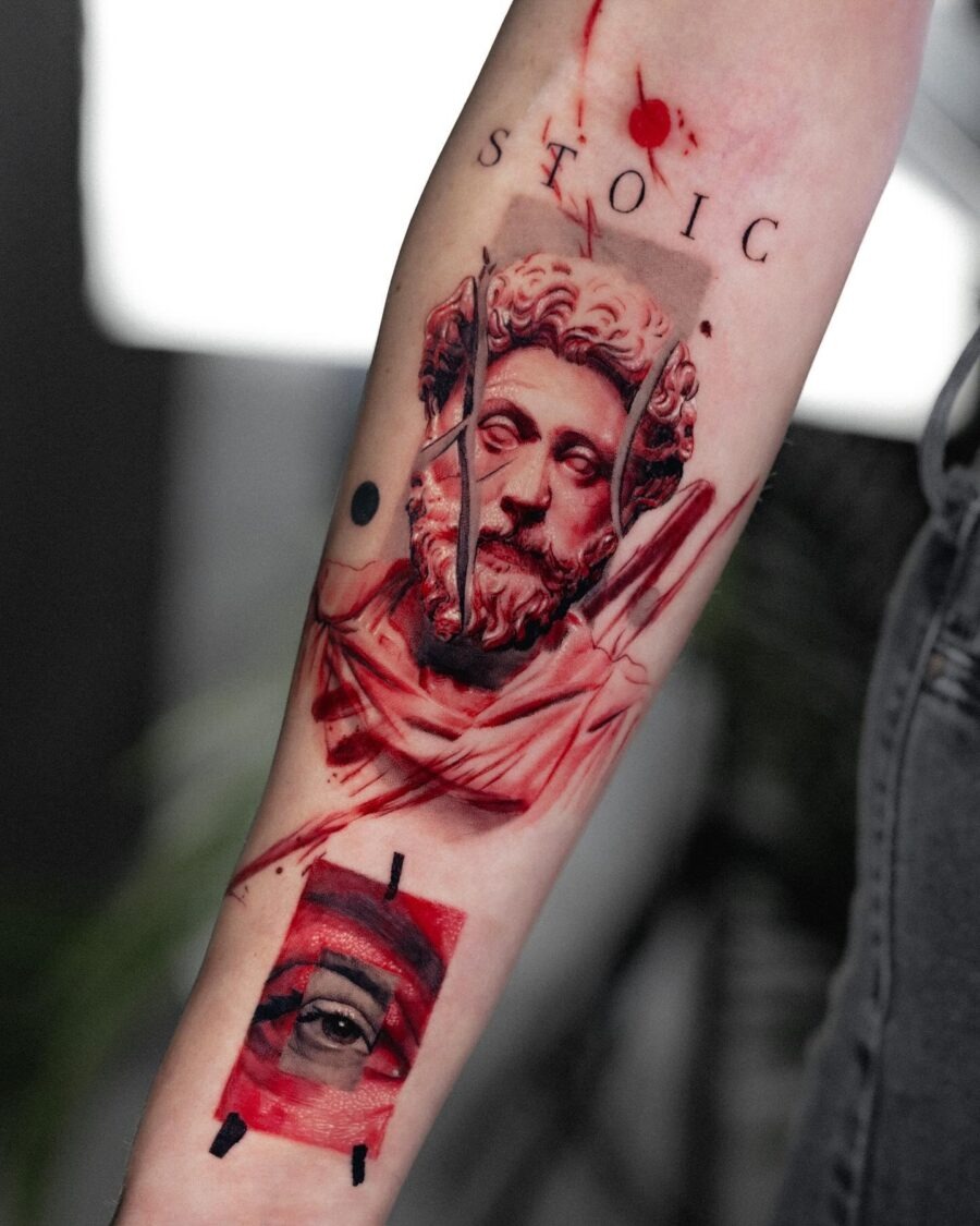 Intricate red ink tattoo design on arm Tattoo Design
