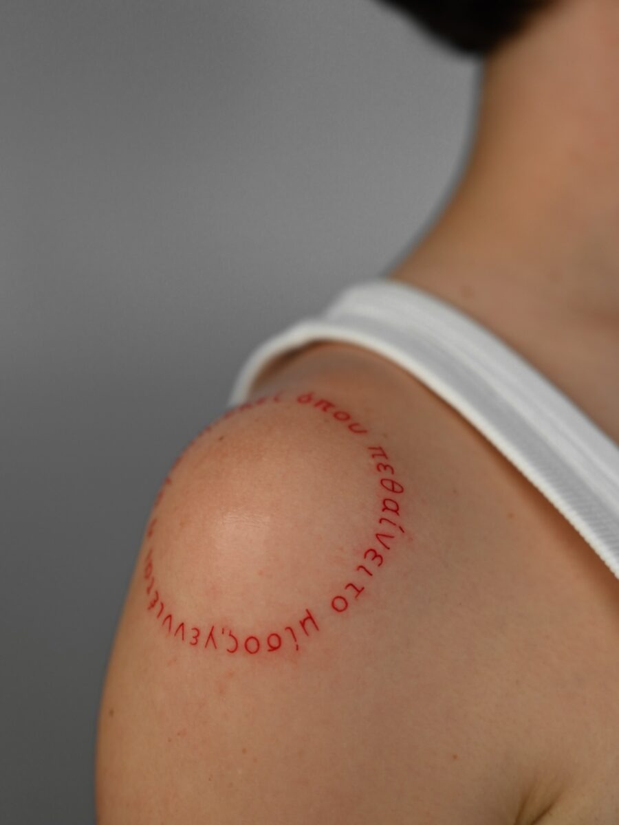 Sleek and modern red ink tattoo design Tattoo Design