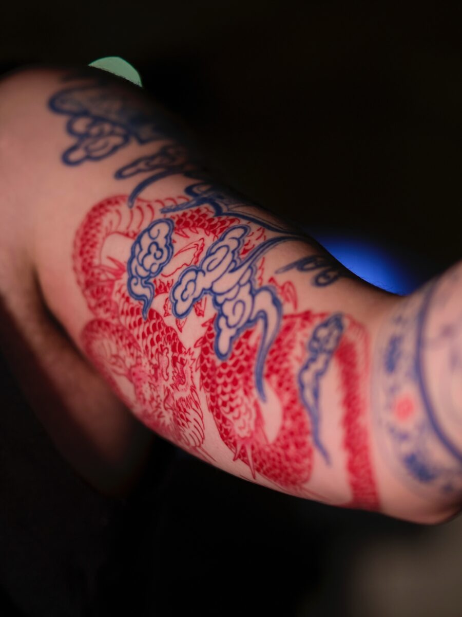 Striking red ink butterfly tattoo design Tattoo Design