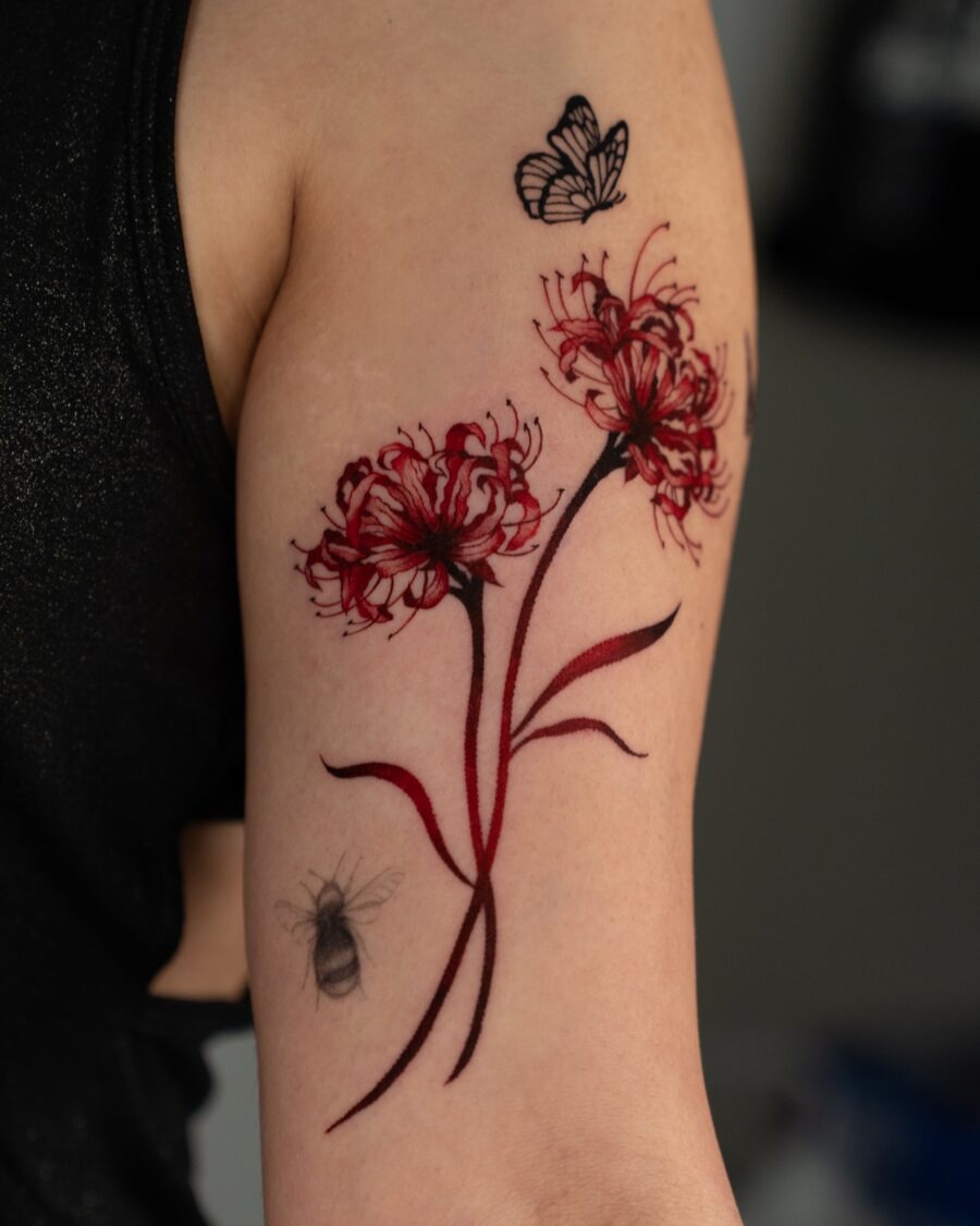 Striking Red Ink Portrait with Crown Detail Tattoo Design