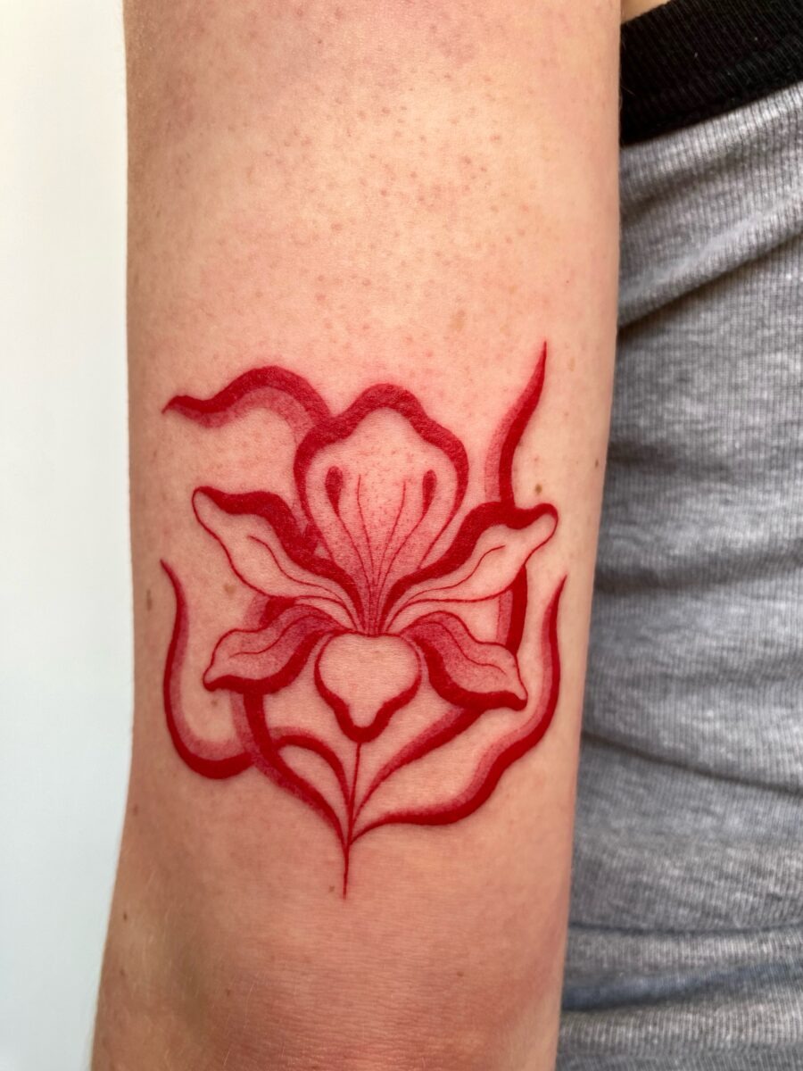 Unique red ink tattoo with swirling designs Tattoo Design