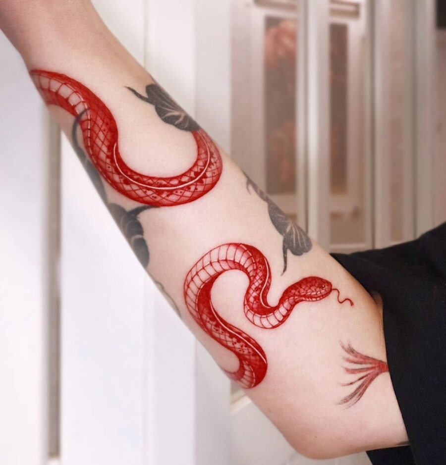 Vibrant red cardinal tattoo in bold style Tattoo Design