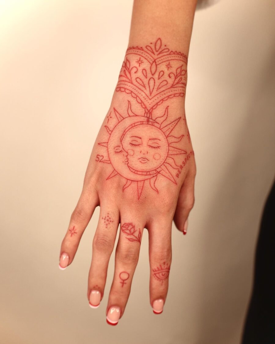 Vibrant red floral tattoo on the arm Tattoo Design