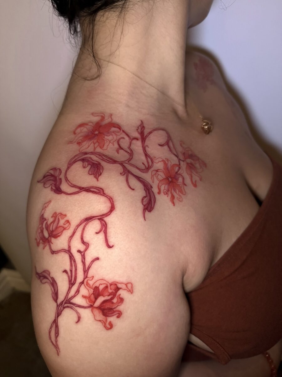 Vibrant Red Ink Floral Tattoo on the Shoulder Tattoo Design