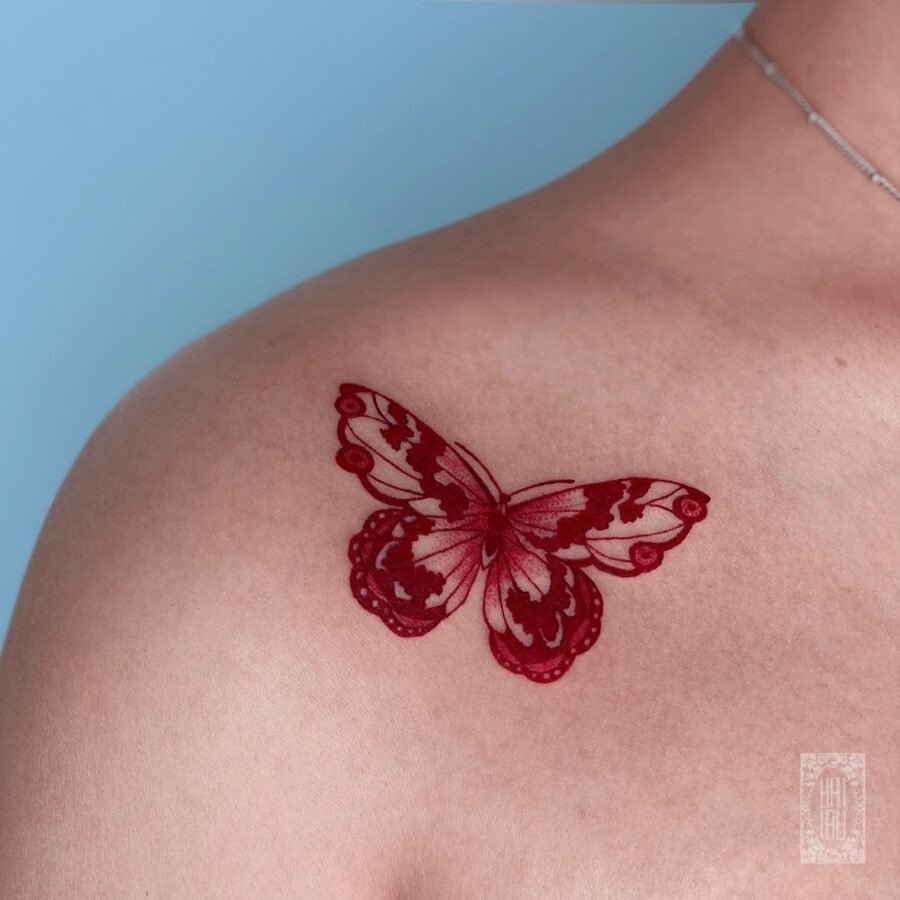 Vibrant Red Ink Goldfish Tattoo with Stars Tattoo Design