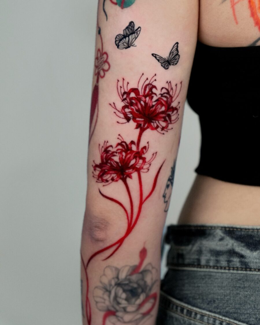 Vibrant red ink hand with floral elements Tattoo Design