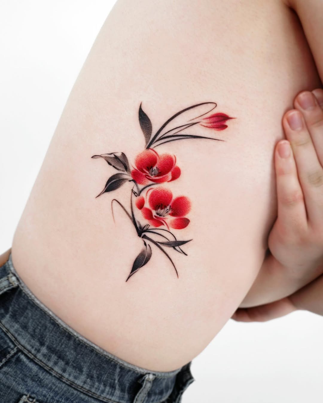 Beautiful Rib Tattoo Design with Red Flowers Tattoo Design