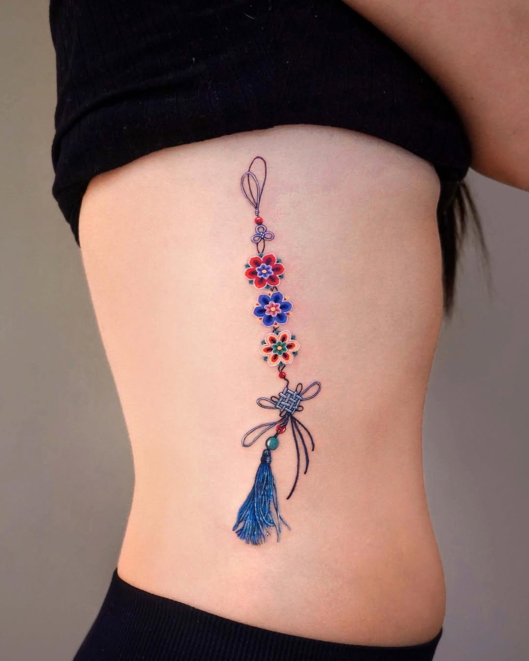 Beautiful Rib Tattoo With Floral Motifs Tattoo Design