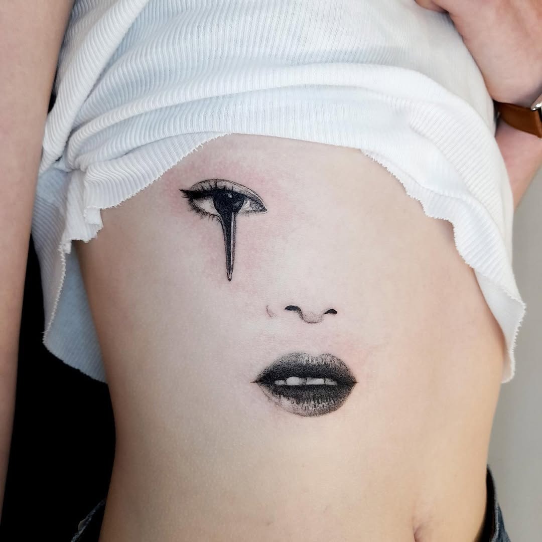 Captivating Rib Tattoo with Artistic Expression Tattoo Design