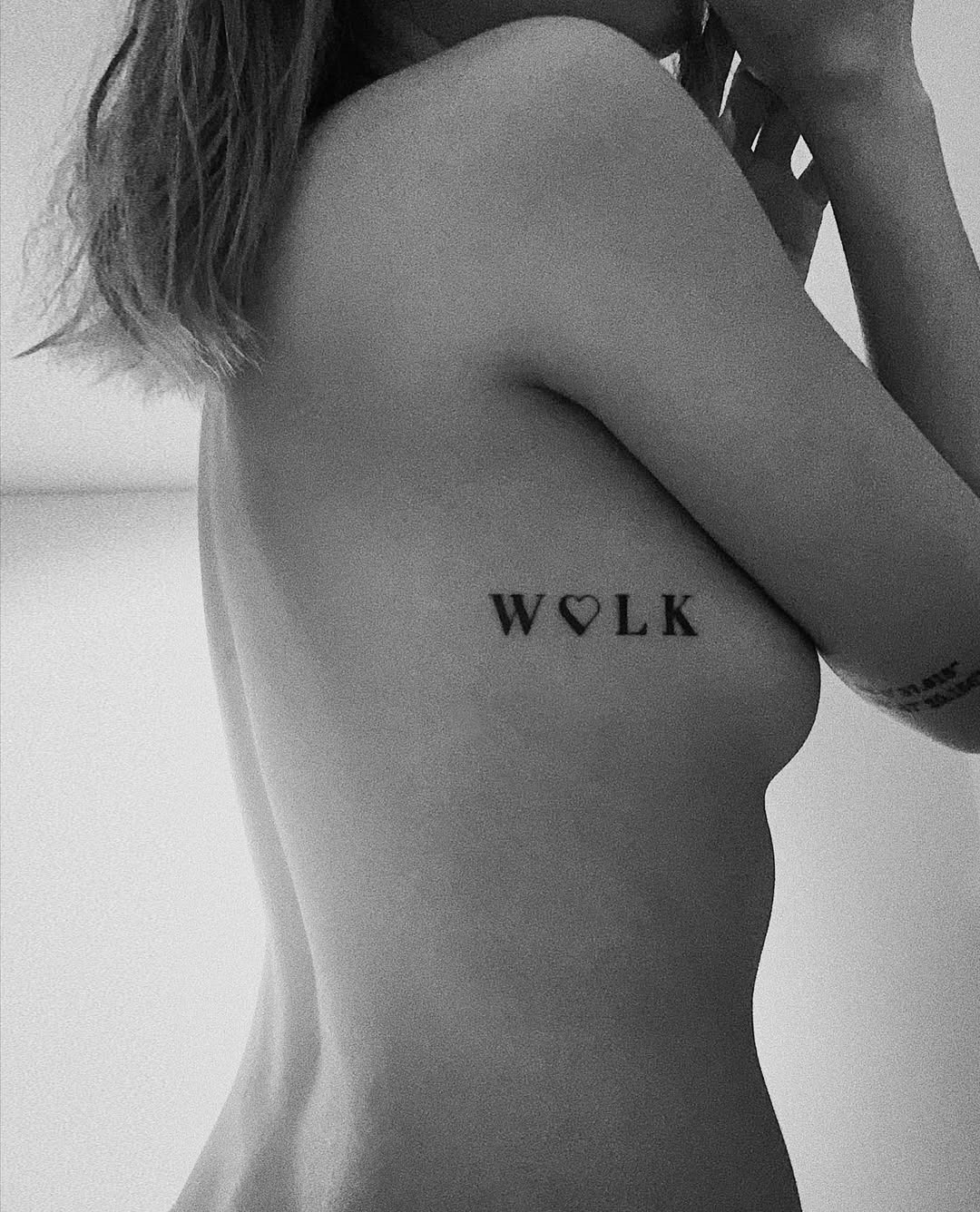 Elegant Rib Tattoo: A Unique Expression Tattoo Design
