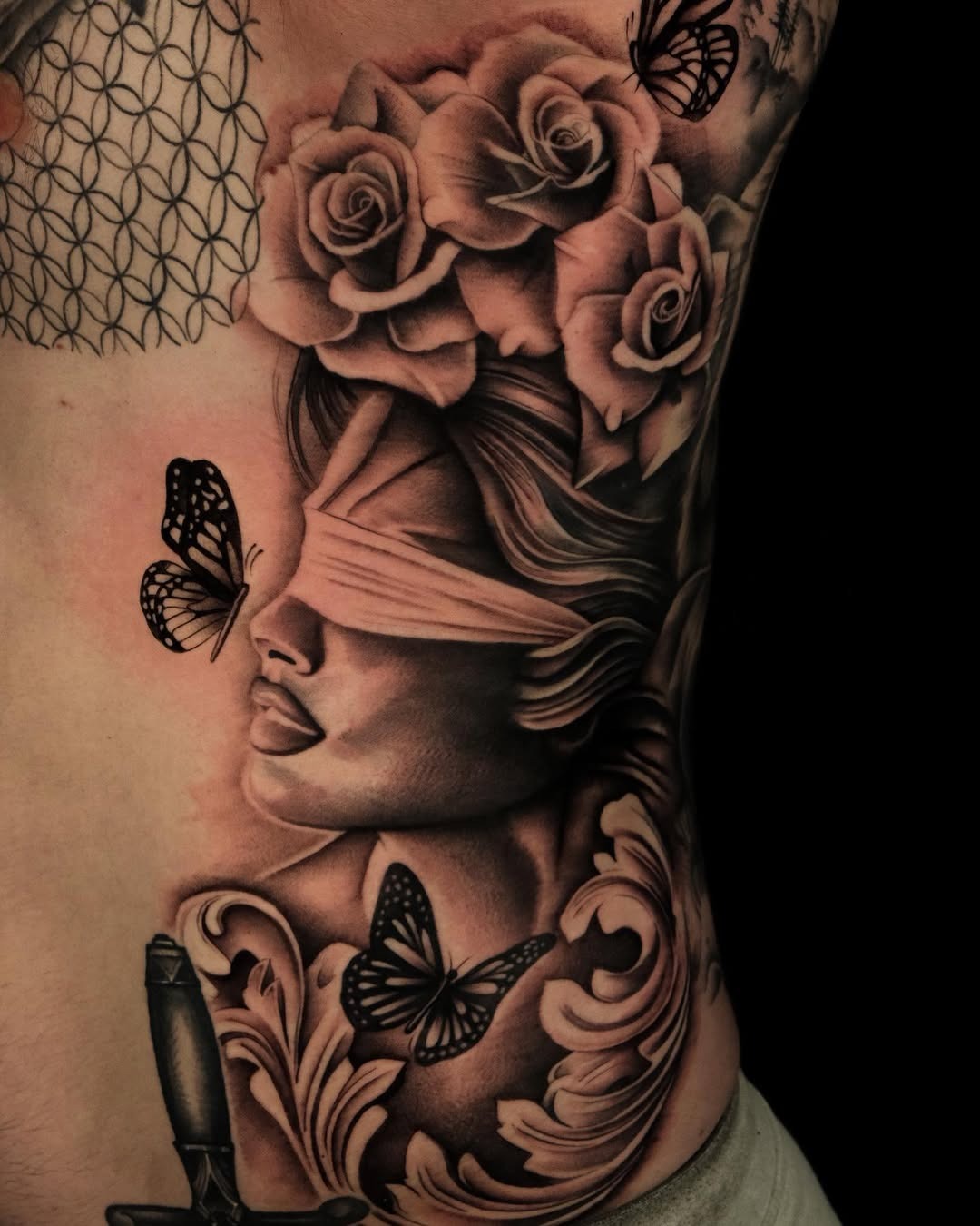 Elegant Rib Tattoo Featuring Roses and Butterflies Tattoo Design