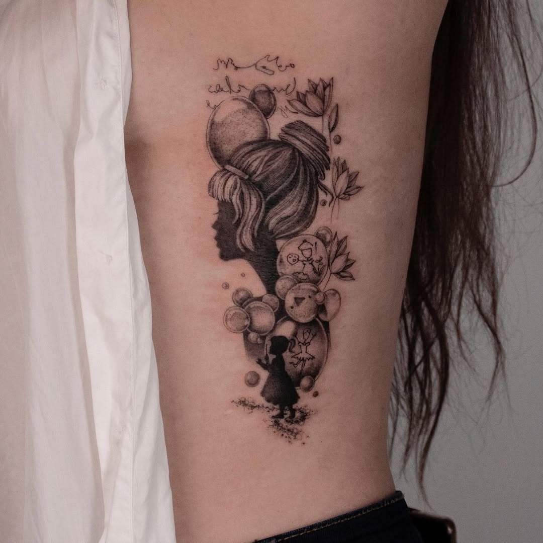 Elegant Rib Tattoo Featuring Silhouettes and Flowers Tattoo Design