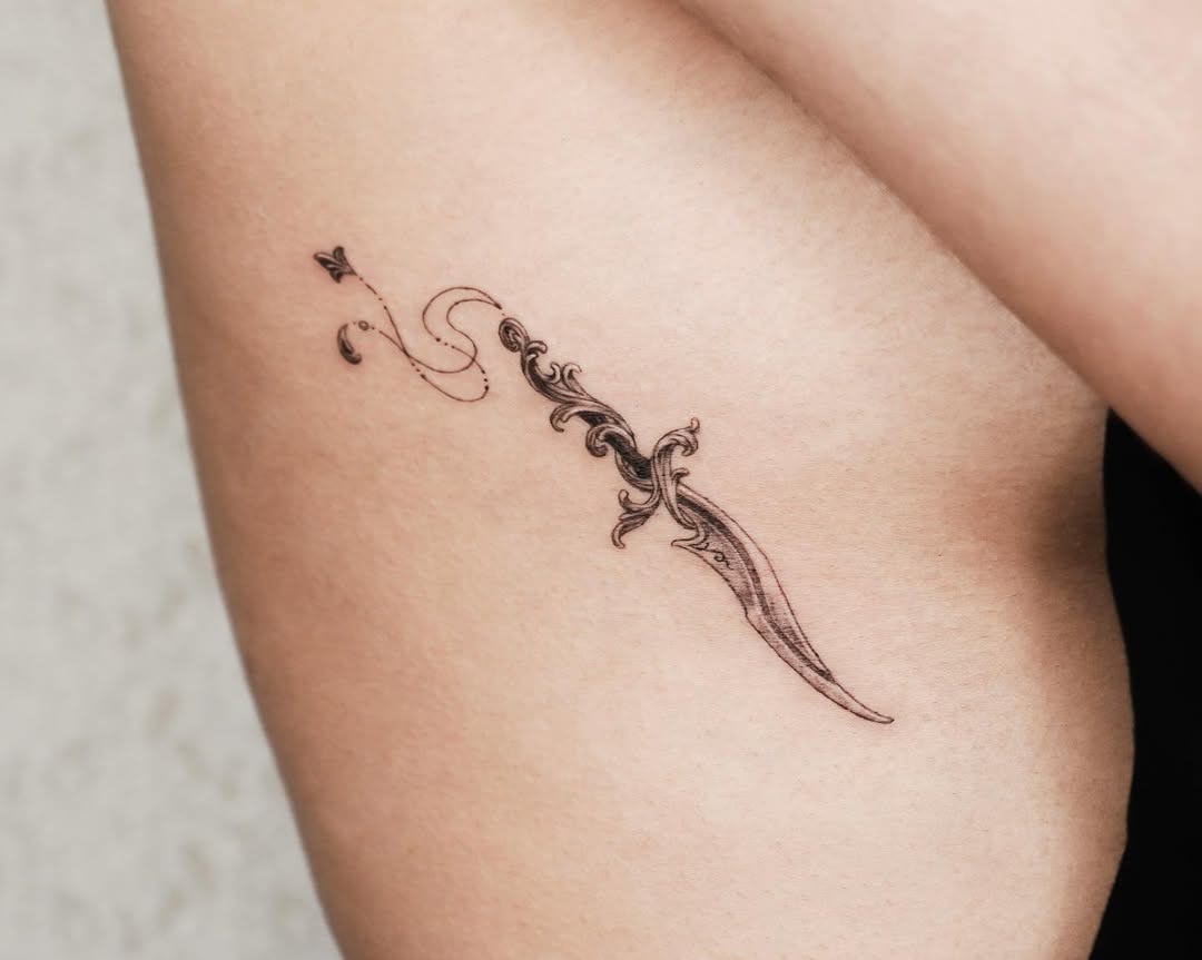 Elegant Rib Tattoo with Floral Knife Design Tattoo Design