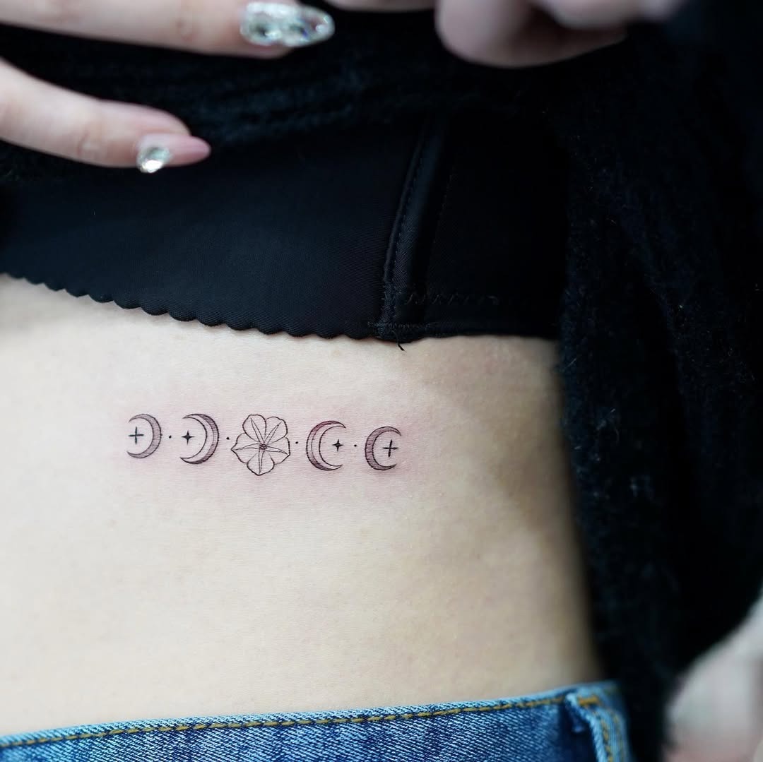 Elegant Rib Tattoo with Moon Phases Tattoo Design