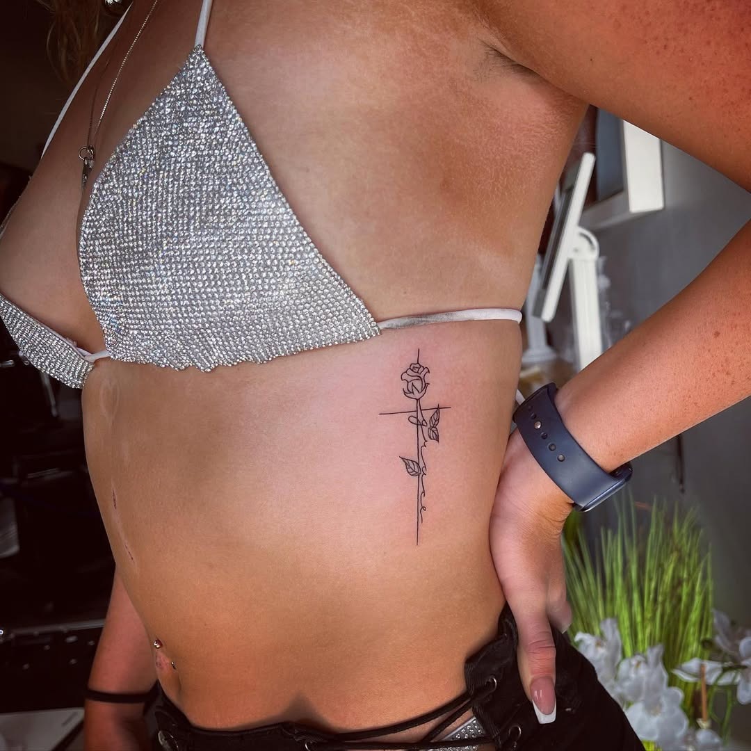 Elegant Rib Tattoo with Rose Design Tattoo Design