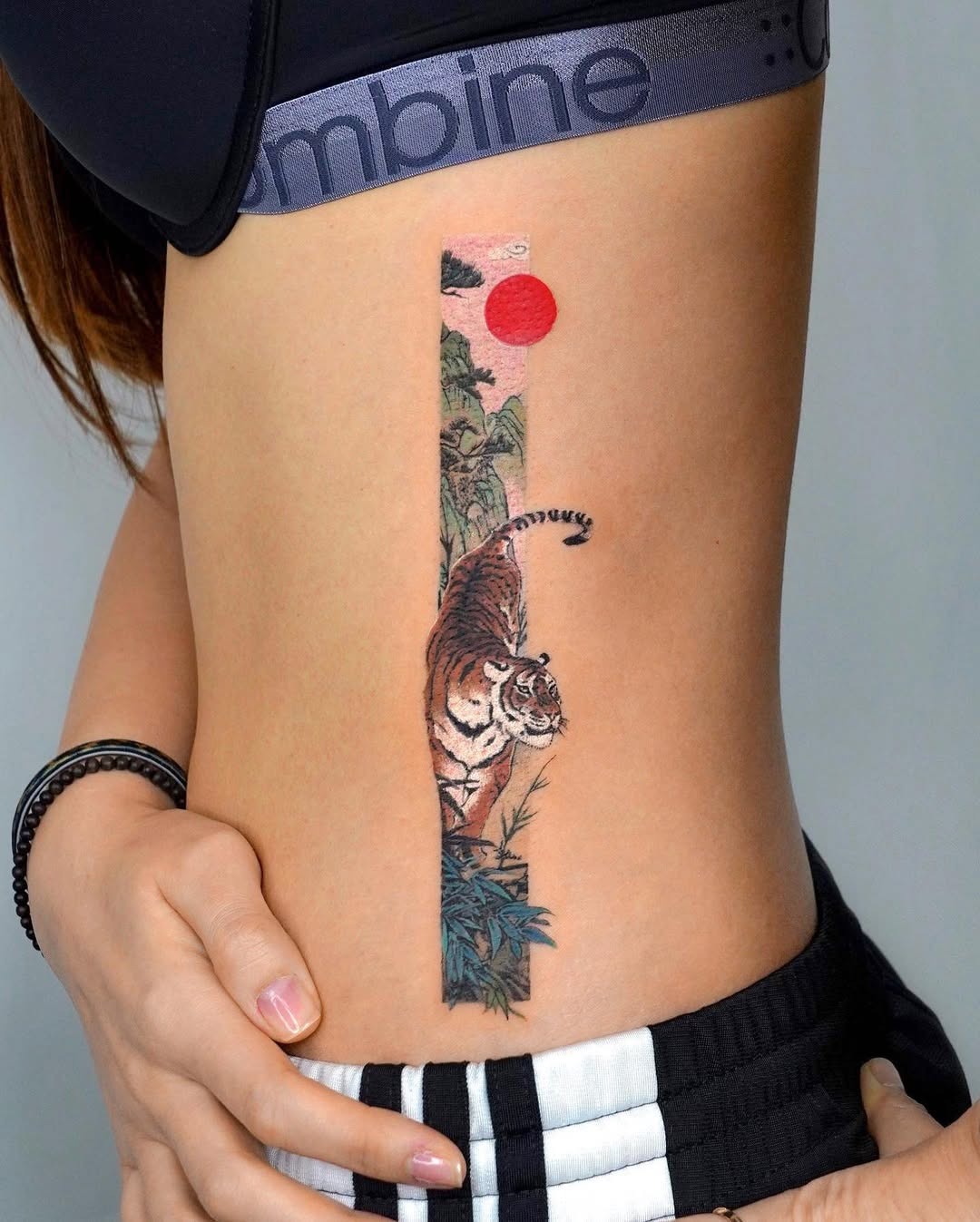 Stunning Rib Tattoo Featuring a Tiger Design Tattoo Design