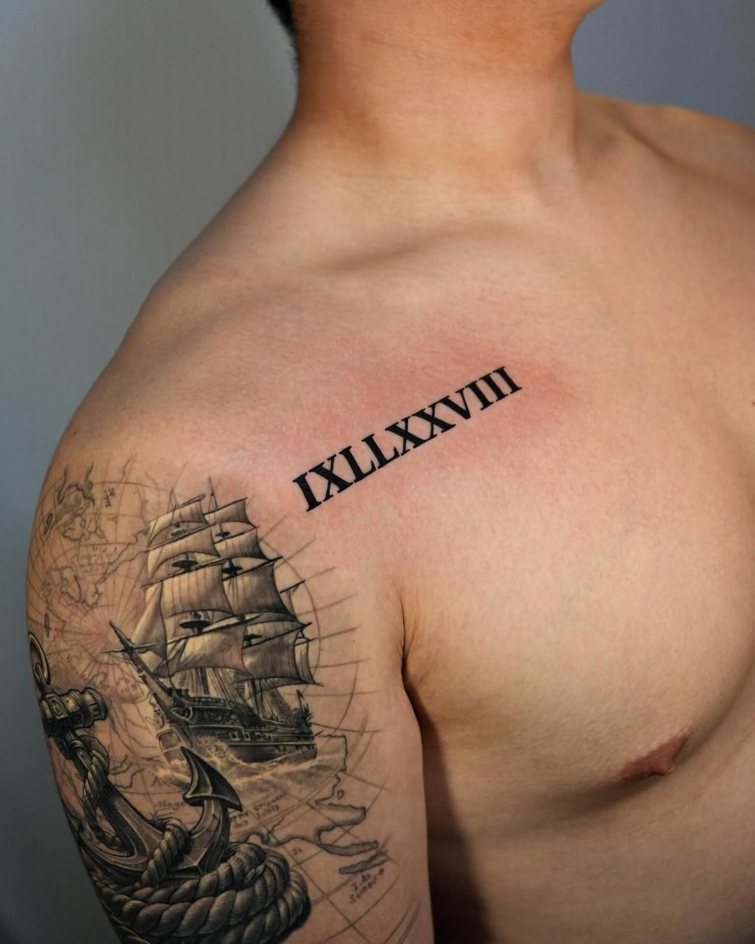 Bold Roman Numeral Tattoo with Nautical Theme Tattoo Design