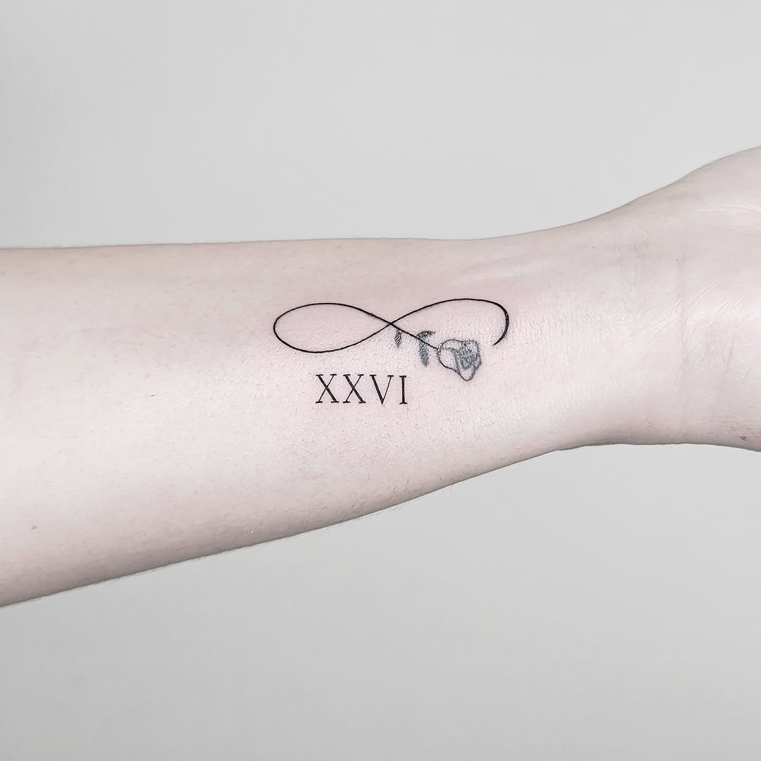 Elegant infinity with Roman numeral XXVI tattoo Tattoo Design