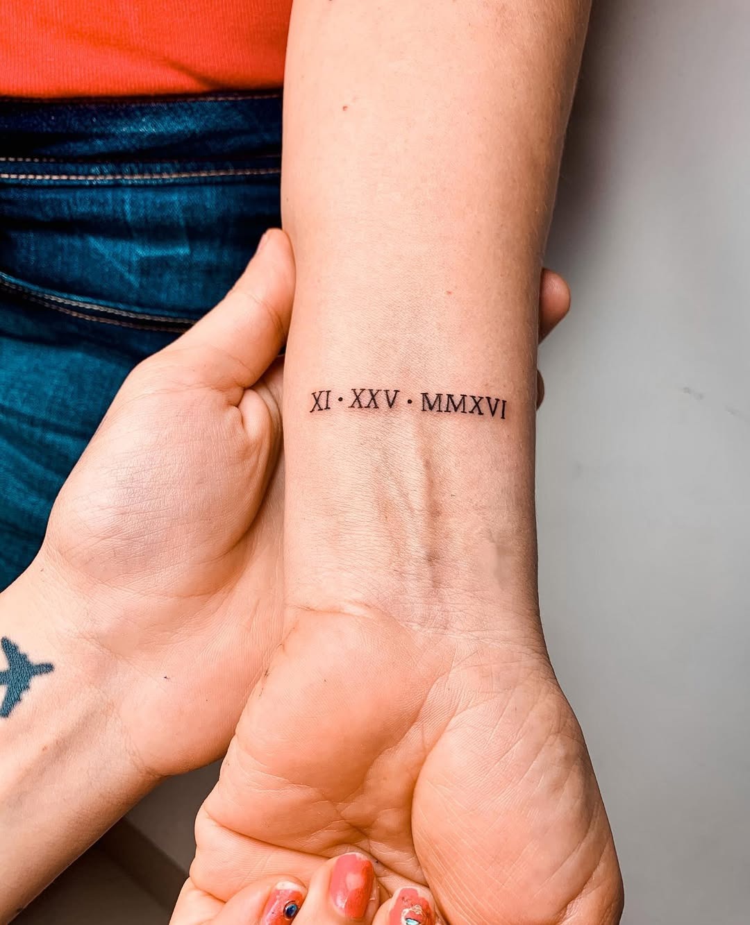 Elegant Roman Numerals Mark Special Dates Tattoo Design