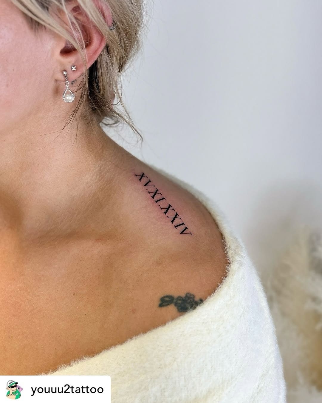 Elegant Roman Numerals on the Shoulder Tattoo Design