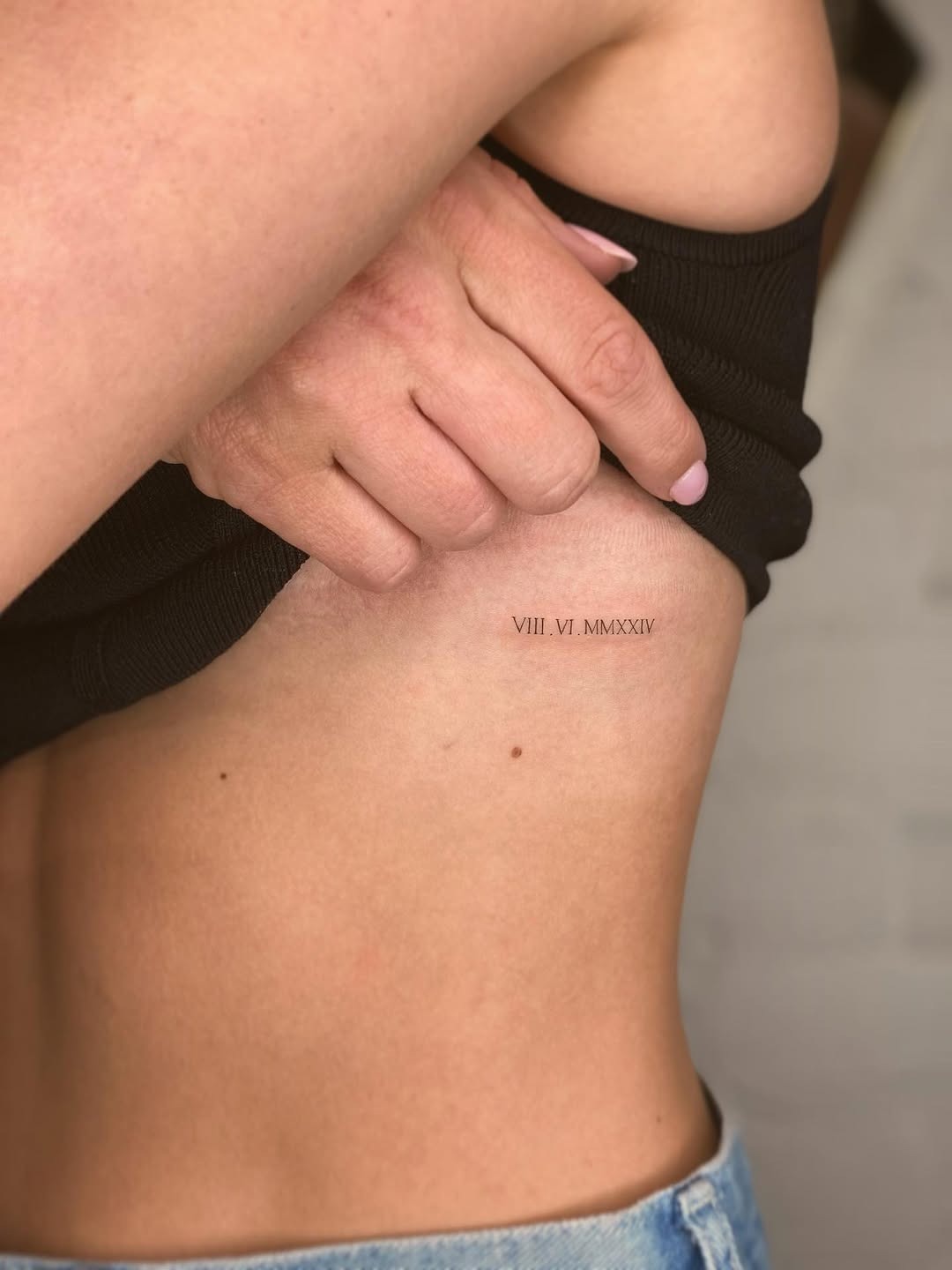 Sleek, minimalistic side rib tattoo design Tattoo Design