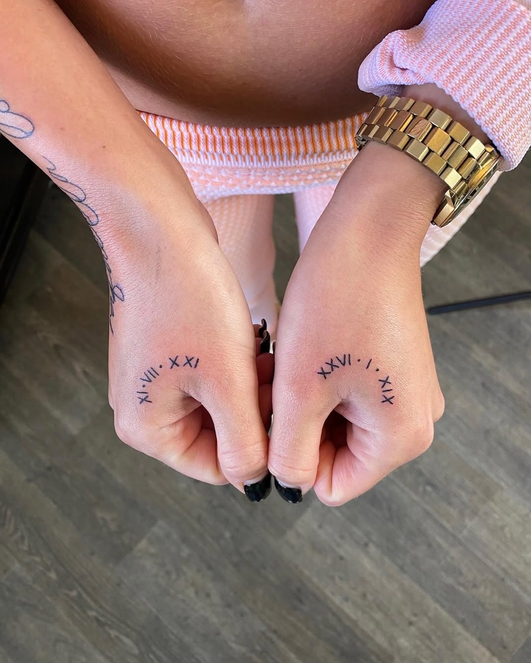 Stylish Roman Numeral Hand Tattoos for Meaningful Moments Tattoo Design