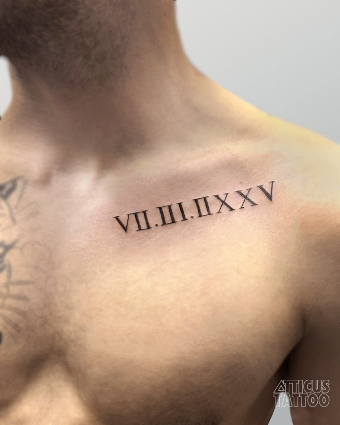 Stylish roman numeral tattoo for men on chest Tattoo Design