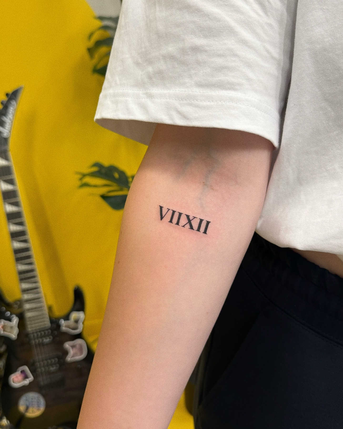 Stylish Roman numeral tattoo on the arm Tattoo Design