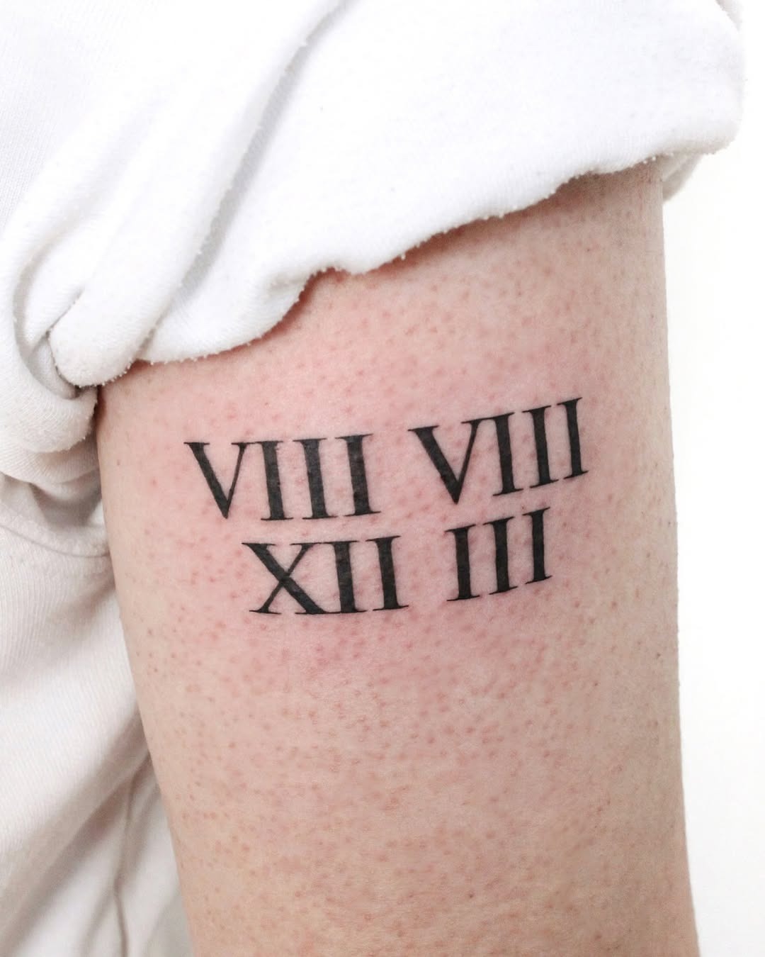 Stylish Roman numeral tattoo with personal significance Tattoo Design