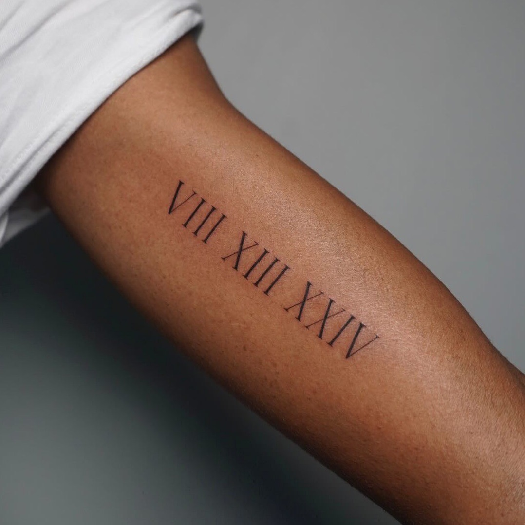 Stylish Roman Numerals in Bold Black Ink Tattoo Design