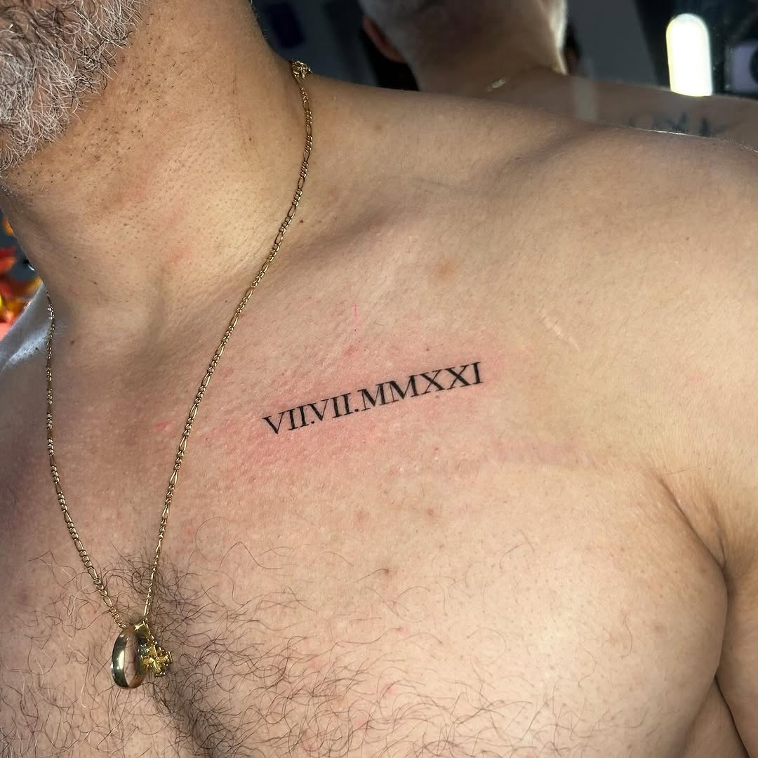 Symbolic chest tattoo with roman numerals Tattoo Design