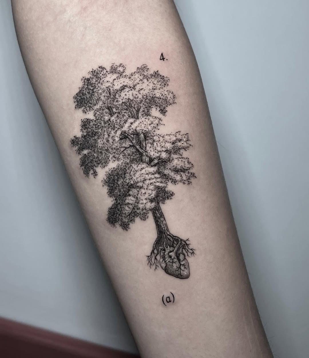 A heart intertwined with a majestic tree Tattoo Design