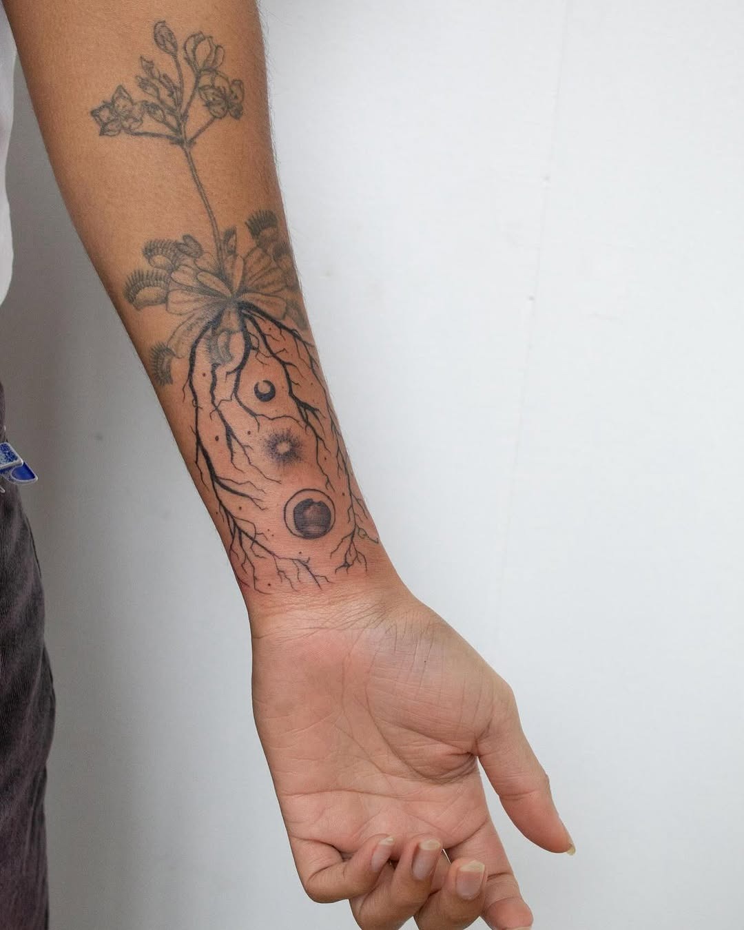 Intricate roots tattoo embracing nature's essence Tattoo Design