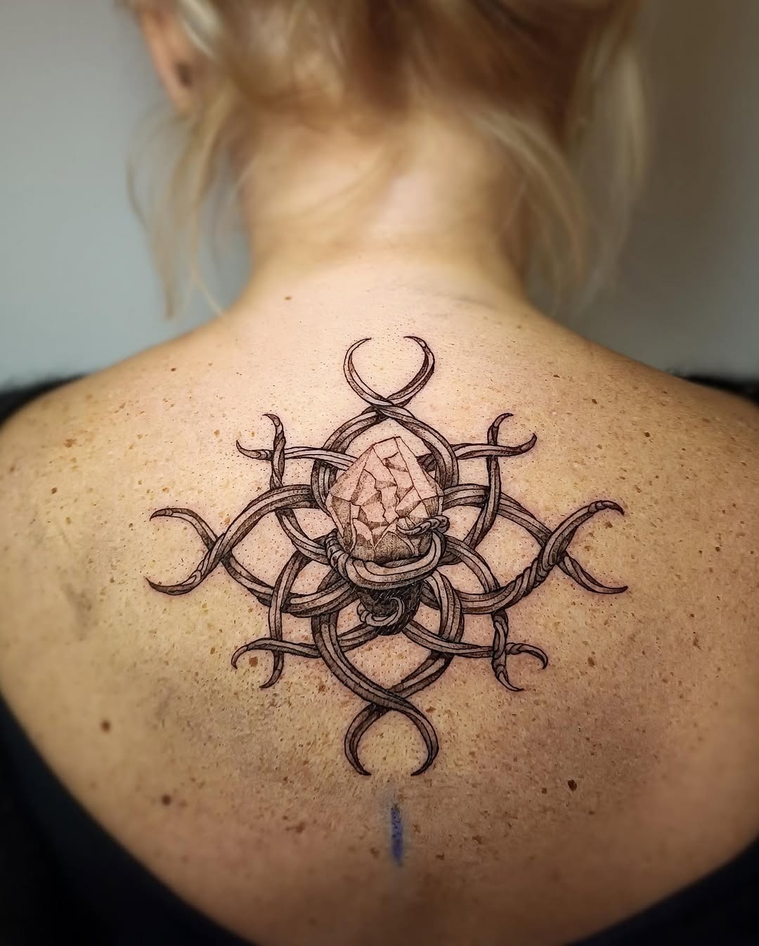 Intricate roots tattoo with crystal centerpiece Tattoo Design
