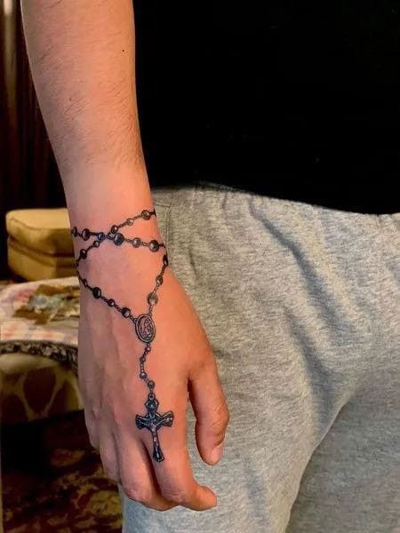 Rosary Wrapped Around the Hand Tattoo Design