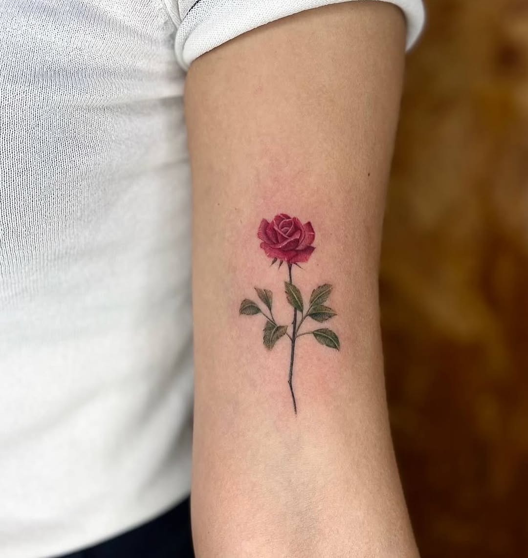 A delicate rose tattoo symbolizing beauty and love Tattoo Design