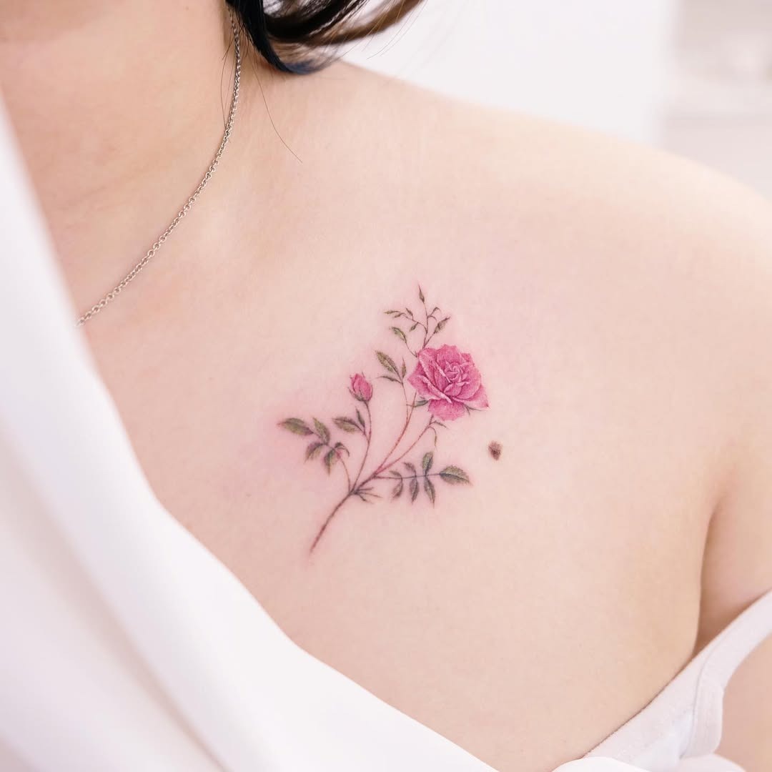 Charming pink rose tattoo on the chest Tattoo Design
