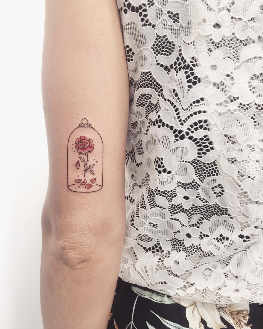 Charming rose tattoo in a whimsical bell jar Tattoo Design