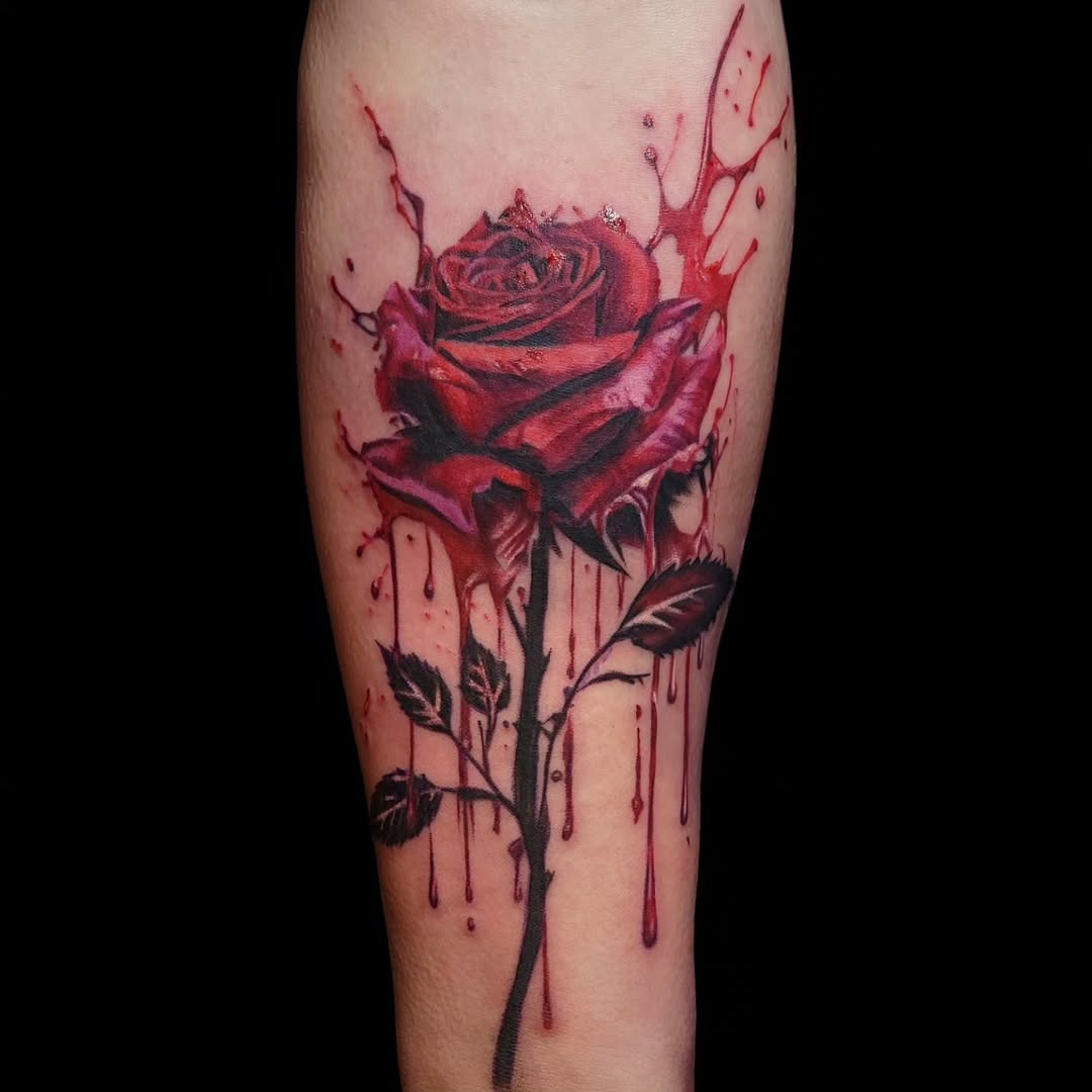 Dramatic red rose tattoo with splashes Tattoo Design