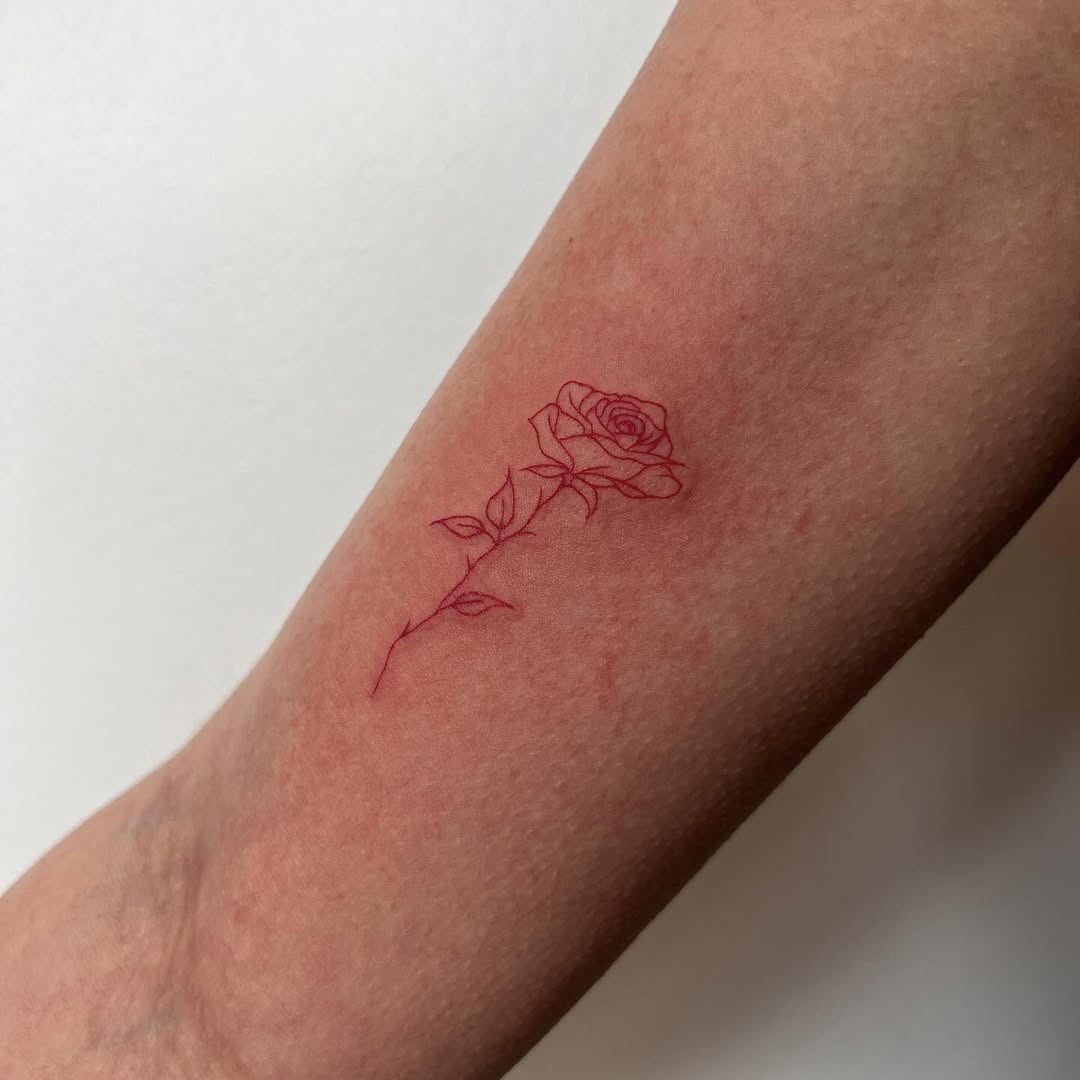 Elegant and minimalist rose tattoo design Tattoo Design